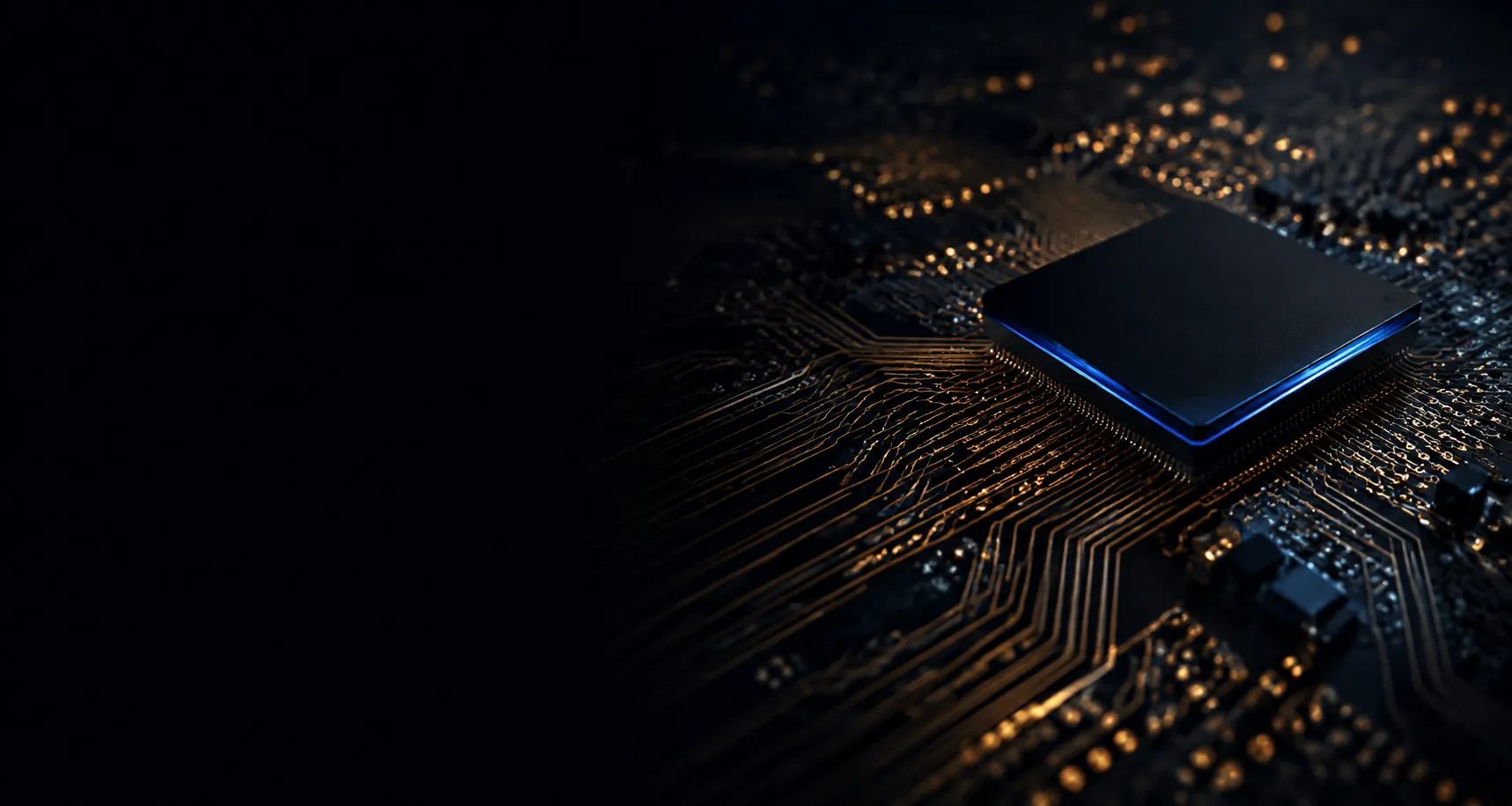 Extreme macro of a circuit board, gold traces running in parallel with a processor die catching a blue edge highlight.